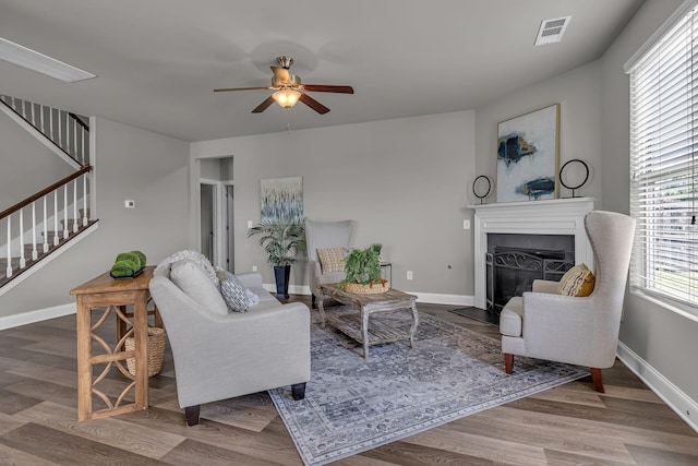 1010 Keeneland Dr, Spring Hill, TN 37174 - living room featuring stairway, a ceiling fan, a glass covered fireplace, baseboards, and wood finished floors