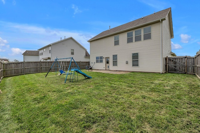 1010 Keeneland Dr, Spring Hill, TN 37174 - back of property featuring a playground and a patio area
