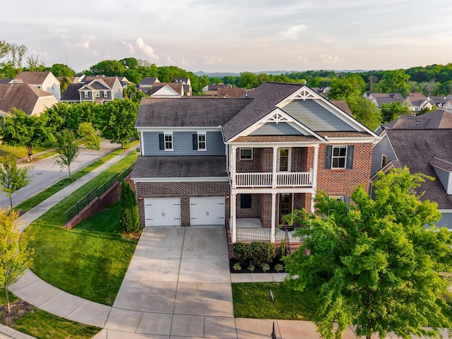 1820 Lanceford Ct, Franklin, TN 37067 - view of front of home featuring brick siding, a balcony, concrete driveway, and a residential view