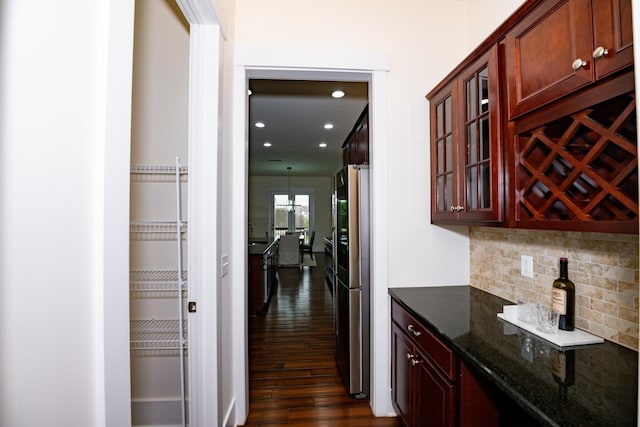 1820 Lanceford Ct, Franklin, TN 37067 - indoor dry bar featuring dark wood-style floors, backsplash, recessed lighting, and freestanding refrigerator
