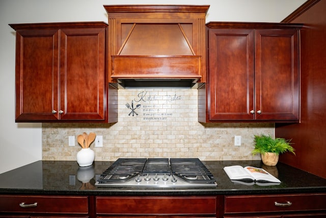 1820 Lanceford Ct, Franklin, TN 37067 - kitchen with dark brown cabinets, premium range hood, stainless steel gas cooktop, and decorative backsplash