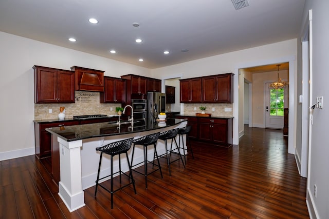 1820 Lanceford Ct, Franklin, TN 37067 - kitchen featuring stainless steel fridge, recessed lighting, dark wood-style floors, a breakfast bar, and decorative backsplash