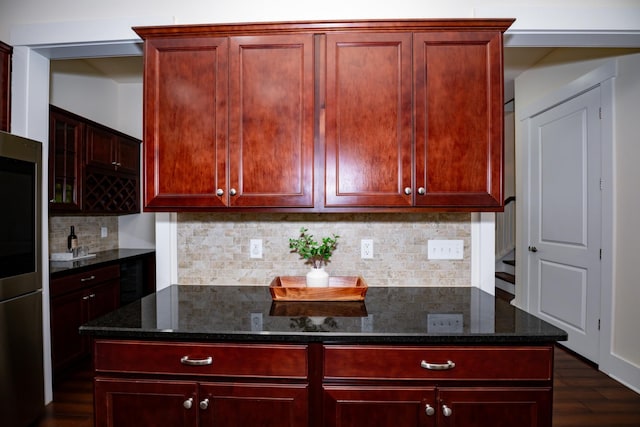 1820 Lanceford Ct, Franklin, TN 37067 - kitchen featuring dark brown cabinets, dark wood-style floors, dark stone countertops, decorative backsplash, and smart refrigerator