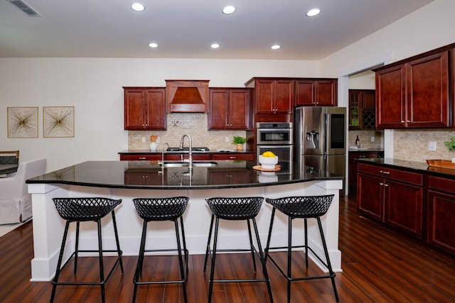 1820 Lanceford Ct, Franklin, TN 37067 - kitchen with stainless steel appliances, custom range hood, a sink, dark wood-type flooring, and dark brown cabinets