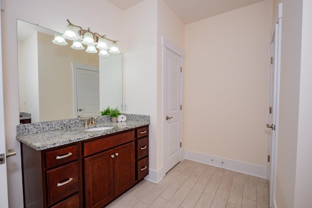 1820 Lanceford Ct, Franklin, TN 37067 - bathroom with vanity, wood finished floors, baseboards, and a chandelier