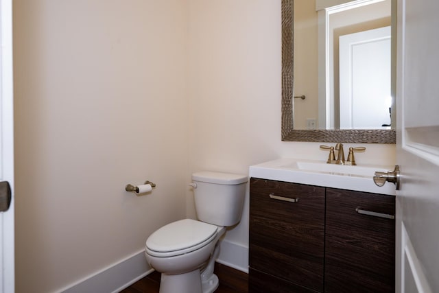 1820 Lanceford Ct, Franklin, TN 37067 - bathroom with vanity, toilet, baseboards, and wood finished floors