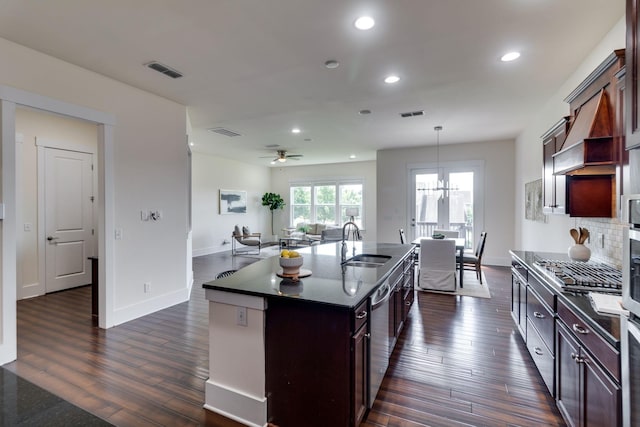 1820 Lanceford Ct, Franklin, TN 37067 - kitchen with a sink, stainless steel appliances, dark wood-type flooring, an island with sink, and recessed lighting