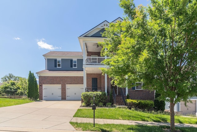 1820 Lanceford Ct, Franklin, TN 37067 - view of front of home with brick siding, a balcony, a garage, and driveway