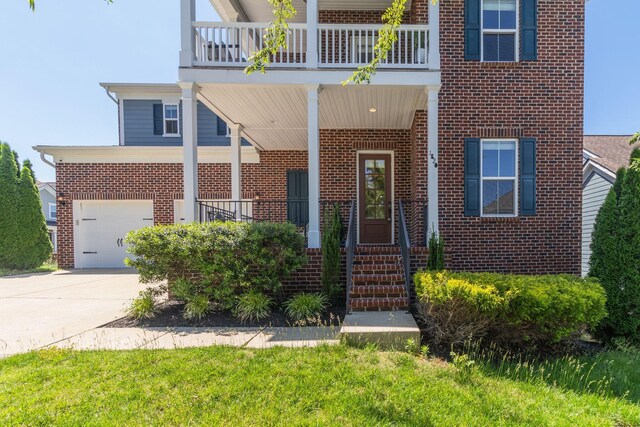 1820 Lanceford Ct, Franklin, TN 37067 - view of front of home with brick siding, driveway, and a balcony