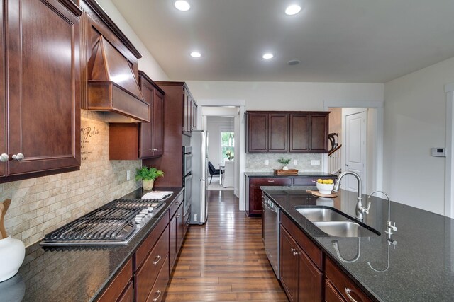 1820 Lanceford Ct, Franklin, TN 37067 - kitchen featuring a sink, appliances with stainless steel finishes, dark wood-style floors, dark stone counters, and recessed lighting