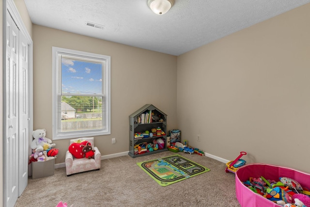 862 College St, Portland, TN 37148 - game room with carpet flooring, a textured ceiling, and baseboards