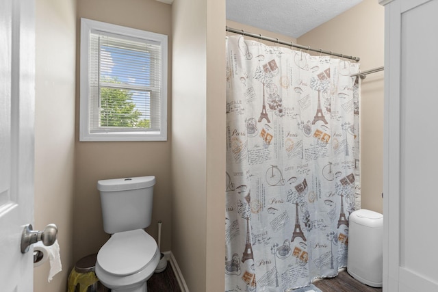 862 College St, Portland, TN 37148 - full bathroom with toilet, wood finished floors, a shower with curtain, and a textured ceiling