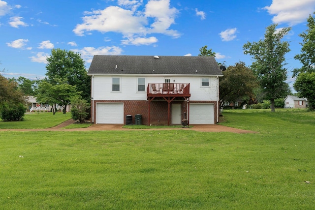 862 College St, Portland, TN 37148 - back of property featuring brick siding, a garage, a yard, a wooden deck, and central air condition unit