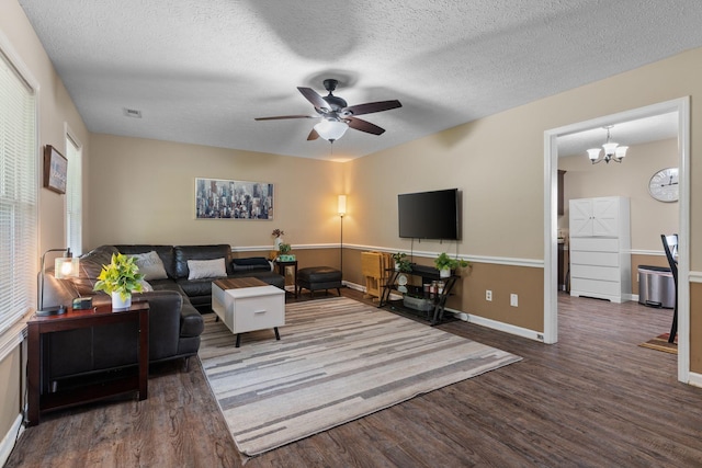 862 College St, Portland, TN 37148 - living room with wood finished floors, ceiling fan, baseboards, a textured ceiling, and a chandelier