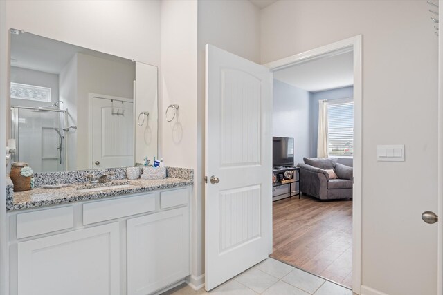 2405 Quinn Dr, White House, TN 37188 - bathroom with tile patterned flooring, vanity, and a shower with shower door