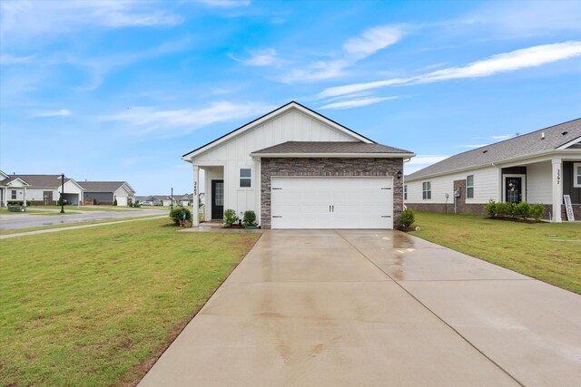 2405 Quinn Dr, White House, TN 37188 - single story home with a front lawn, stone siding, concrete driveway, and a garage