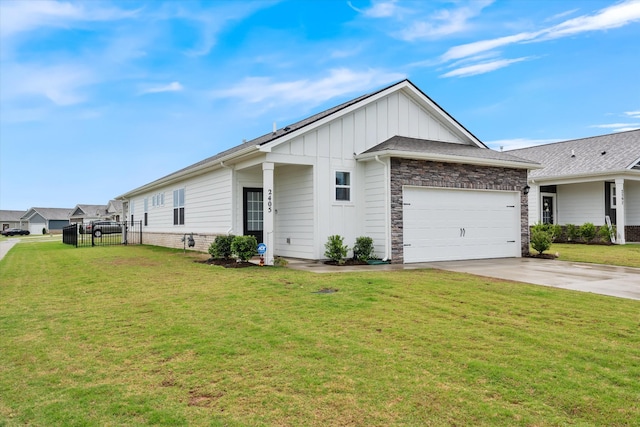2405 Quinn Dr, White House, TN 37188 - view of home's exterior featuring board and batten siding, concrete driveway, an attached garage, and stone siding