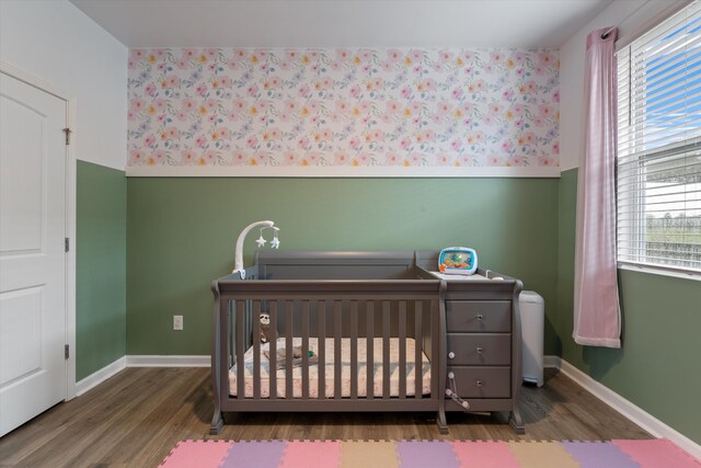 2405 Quinn Dr, White House, TN 37188 - bedroom featuring wood finished floors, a crib, and multiple windows