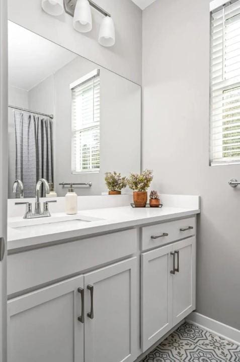 2120 Herman St Unit 9, Nashville, TN 37208 - full bath with vanity, baseboards, and curtained shower