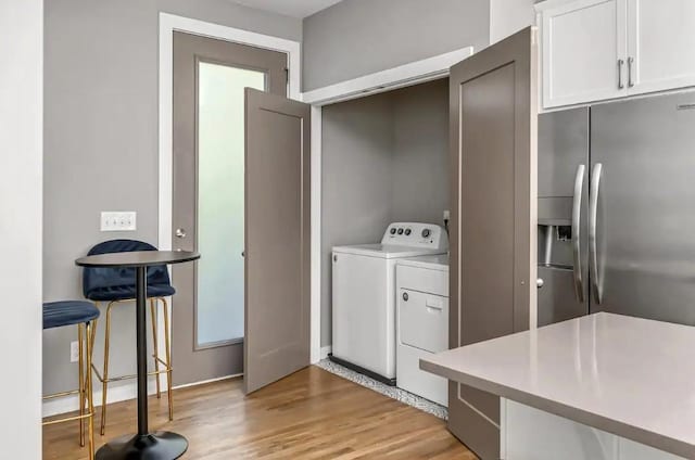 2120 Herman St Unit 9, Nashville, TN 37208 - laundry room with washer and clothes dryer and light wood-style floors