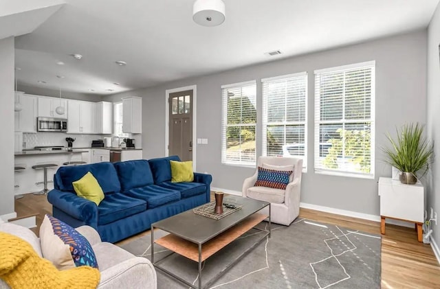 2120 Herman St Unit 9, Nashville, TN 37208 - living area with healthy amount of natural light, baseboards, light wood-style floors, and recessed lighting