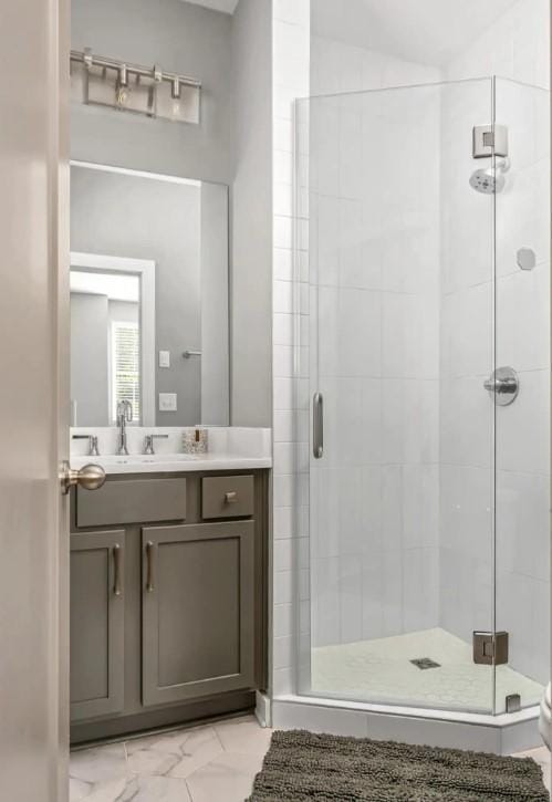2120 Herman St Unit 8, Nashville, TN 37208 - bathroom with a shower stall, vanity, and marble look tile flooring