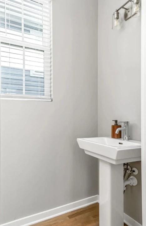 2120 Herman St Unit 8, Nashville, TN 37208 - bathroom featuring baseboards and wood finished floors