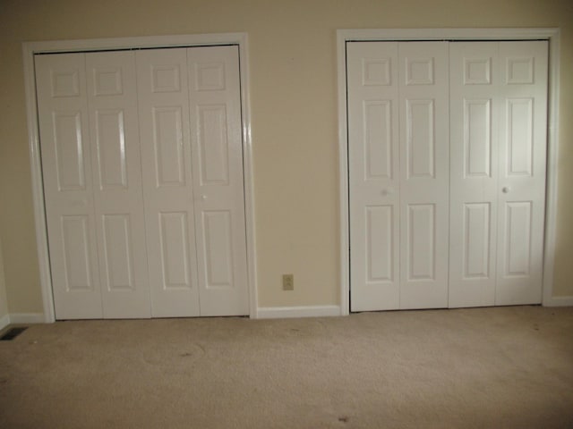 6225 Mount View Rd, Antioch, TN 37013 - unfurnished bedroom with carpet flooring, two closets, and baseboards