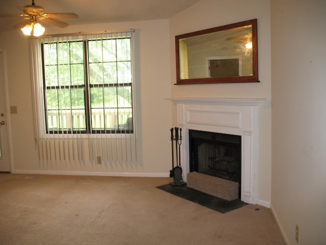6225 Mount View Rd, Antioch, TN 37013 - unfurnished living room with carpet flooring, baseboards, ceiling fan, and a fireplace with flush hearth