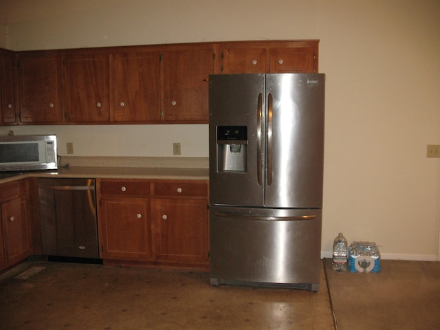6225 Mount View Rd, Antioch, TN 37013 - kitchen with stainless steel appliances, baseboards, and brown cabinets