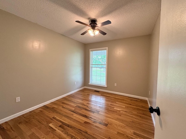 410 Sunset Ln, Monterey, TN 38574 - spare room featuring a ceiling fan, wood finished floors, a textured ceiling, and baseboards