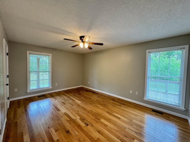 410 Sunset Ln, Monterey, TN 38574 - unfurnished room featuring hardwood / wood-style floors, ceiling fan, baseboards, and a textured ceiling