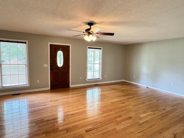 410 Sunset Ln, Monterey, TN 38574 - entrance foyer with ceiling fan, light wood-style floors, a textured ceiling, and baseboards