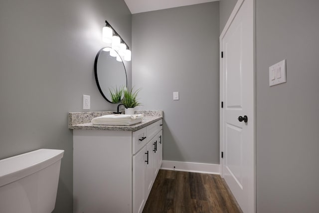 85 Truform Way, Dickson, TN 37055 - half bathroom featuring wood finished floors, vanity, toilet, and baseboards