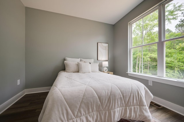 85 Truform Way, Dickson, TN 37055 - bedroom with multiple windows, baseboards, dark wood-type flooring, and lofted ceiling
