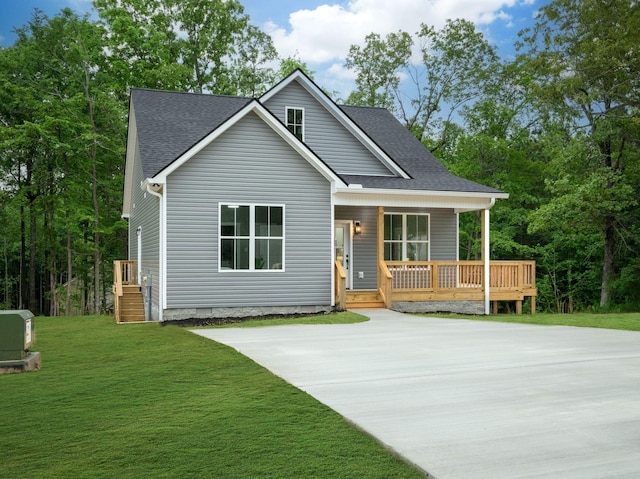 85 Truform Way, Dickson, TN 37055 - view of front of house featuring a front lawn, roof with shingles, and covered porch
