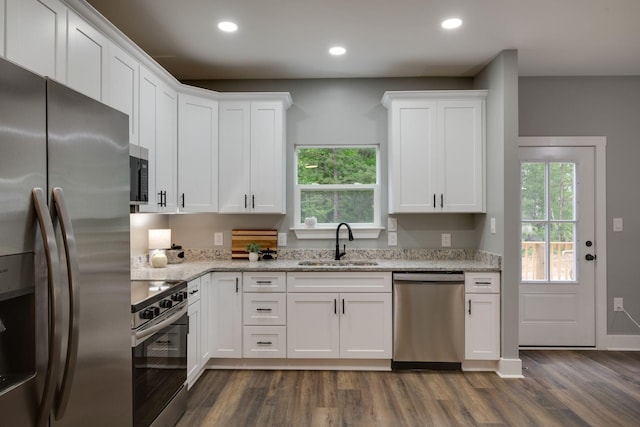 85 Truform Way, Dickson, TN 37055 - kitchen featuring stainless steel appliances, a sink, dark wood-type flooring, white cabinets, and recessed lighting