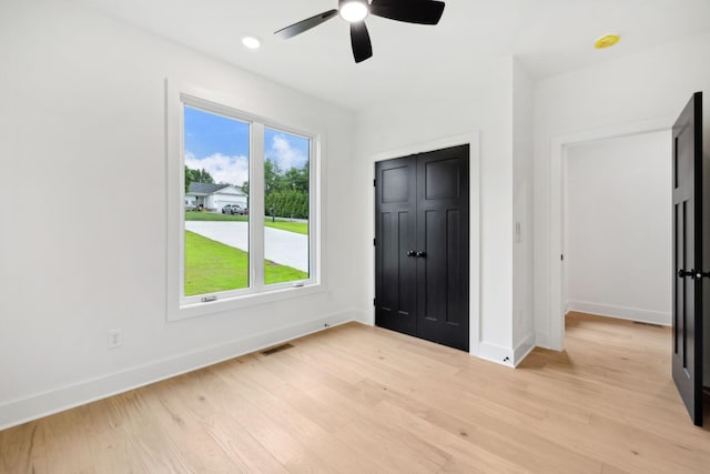 811 Oconner St, Smithville, TN 37166 - unfurnished bedroom with baseboards, light wood-style floors, and ceiling fan