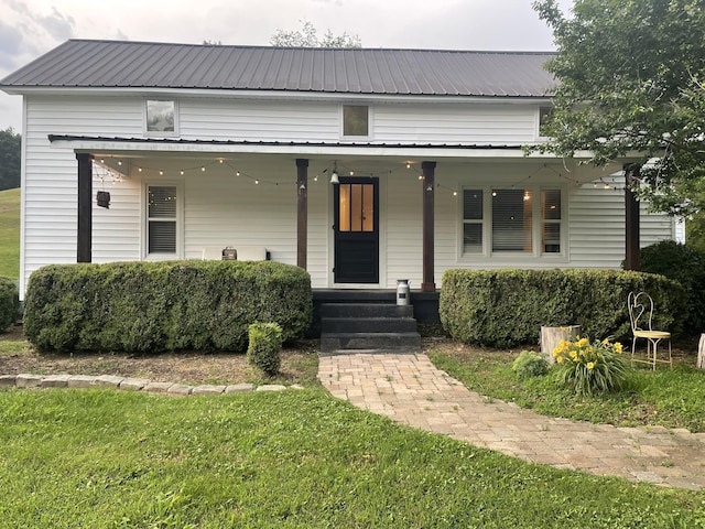 1200 Wray Branch Rd, Minor Hill, TN 38473 - view of front of house featuring a porch, metal roof, and a front yard