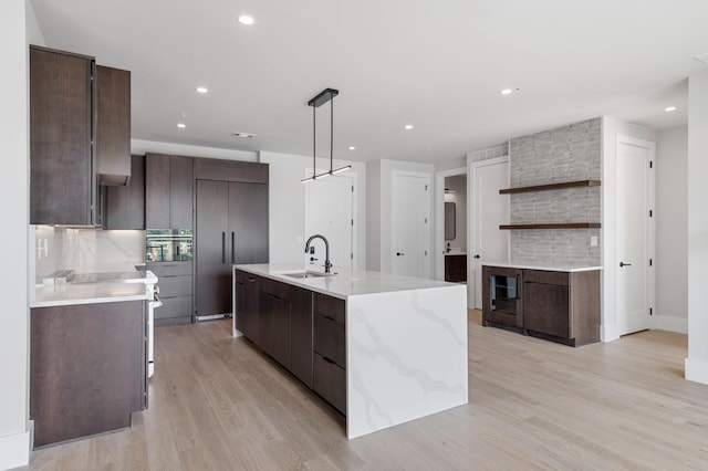 321 31st Ave N Unit B8 A, Nashville, TN 37203 - kitchen with modern cabinets, tasteful backsplash, light wood-style floors, and recessed lighting