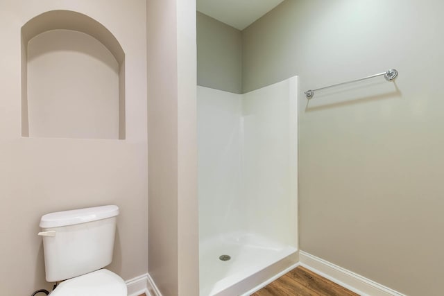4316 Summercrest Blvd Unit 512, Antioch, TN 37013 - bathroom with a shower stall, toilet, baseboards, and wood finished floors