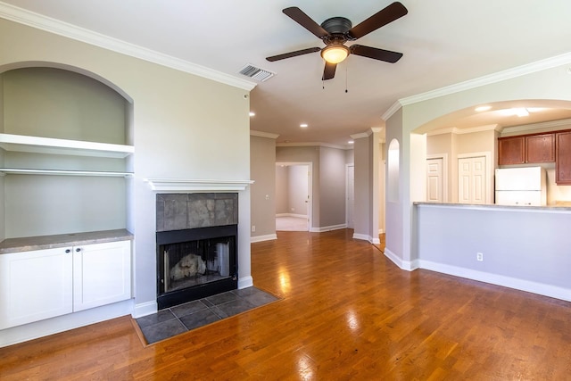 4316 Summercrest Blvd Unit 512, Antioch, TN 37013 - unfurnished living room featuring a ceiling fan, wood finished floors, a tiled fireplace, recessed lighting, and crown molding