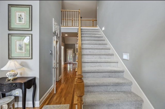 5122 Stonewood Dr, Smyrna, TN 37167 - staircase with wood finished floors, baseboards, and a high ceiling