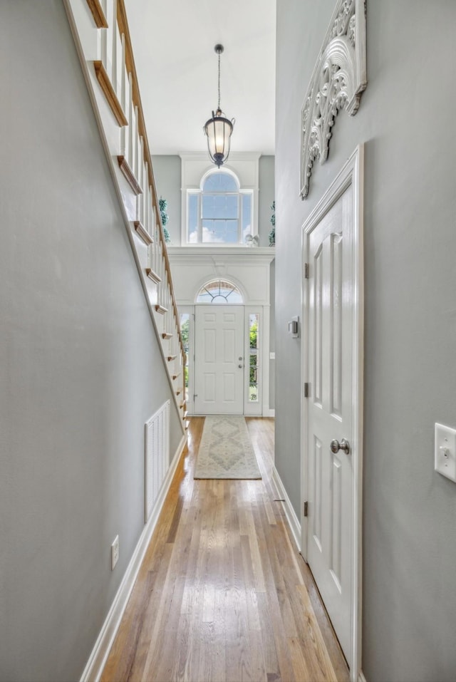 5122 Stonewood Dr, Smyrna, TN 37167 - entrance foyer with light wood-type flooring, baseboards, a towering ceiling, and stairs