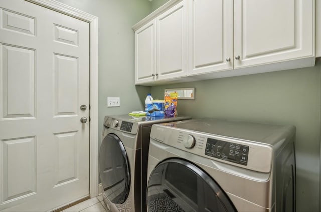 5122 Stonewood Dr, Smyrna, TN 37167 - washroom with washer and dryer, cabinet space, and light tile patterned floors