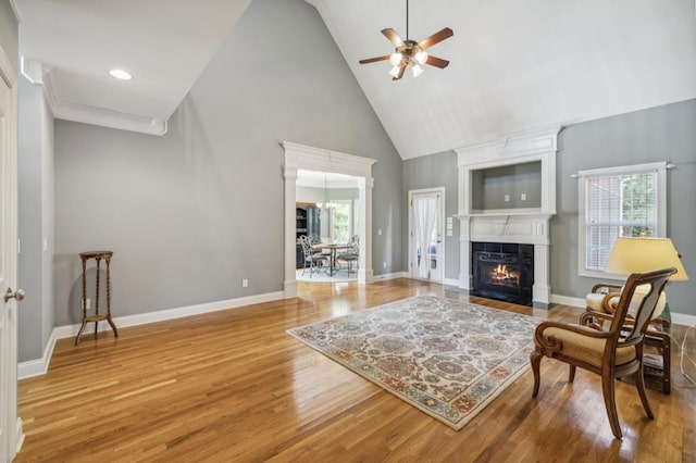 5122 Stonewood Dr, Smyrna, TN 37167 - living room with ceiling fan, high vaulted ceiling, a large fireplace, wood finished floors, and baseboards