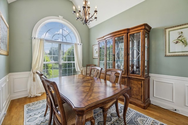 5122 Stonewood Dr, Smyrna, TN 37167 - dining space with a chandelier, a wainscoted wall, light wood-style floors, a decorative wall, and lofted ceiling