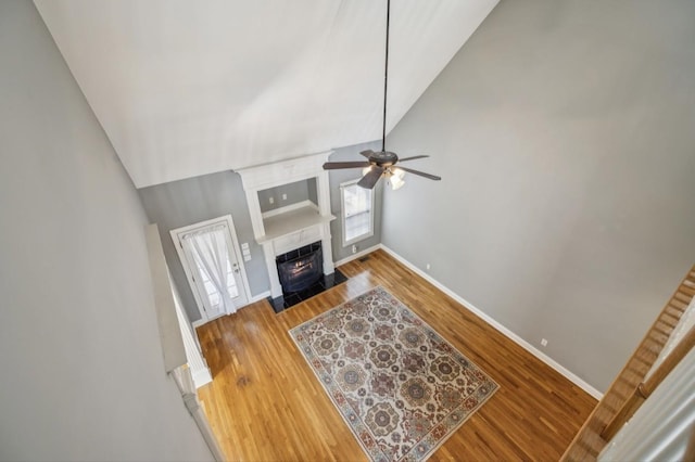 5122 Stonewood Dr, Smyrna, TN 37167 - living room with ceiling fan, baseboards, wood finished floors, a fireplace with flush hearth, and high vaulted ceiling