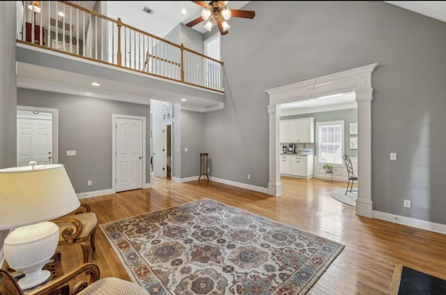 5122 Stonewood Dr, Smyrna, TN 37167 - living area with ceiling fan, a towering ceiling, light wood-type flooring, and baseboards