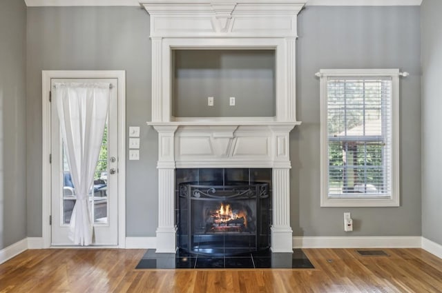 5122 Stonewood Dr, Smyrna, TN 37167 - detailed view of wood finished floors, a tile fireplace, and baseboards
